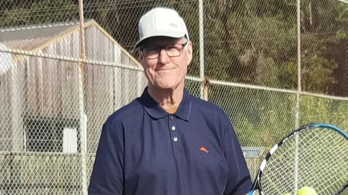Man holding a tennis racket on a court Man holding a tennis racket on a court