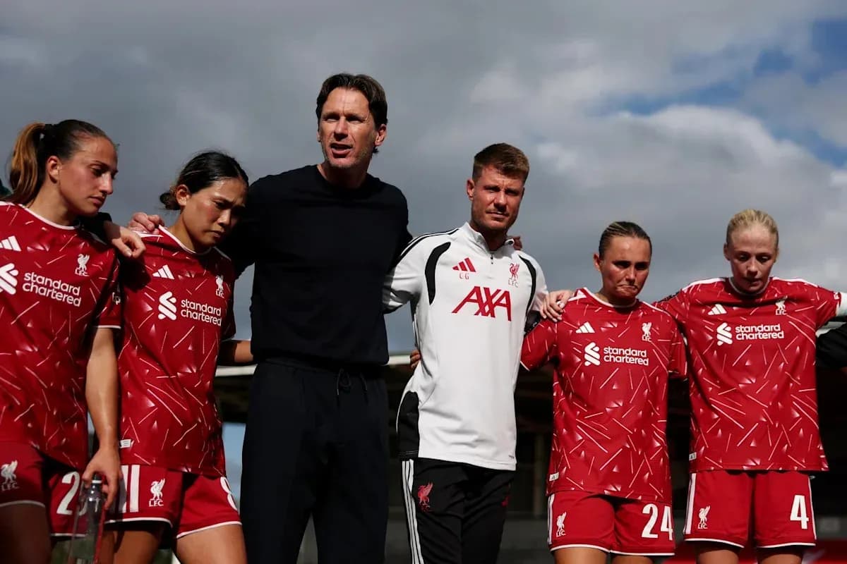 Liverpool women's team huddled with coaches before match Liverpool women's team huddled with coaches before match