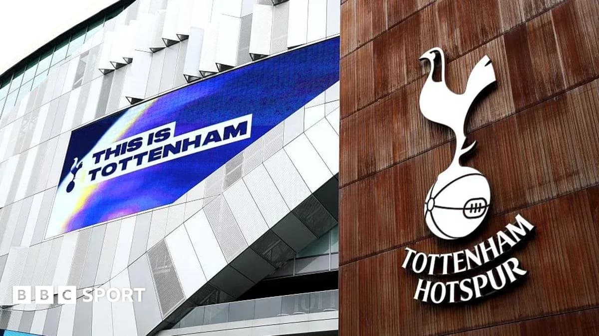Tottenham Hotspur stadium exterior with club logo Tottenham Hotspur stadium exterior with club logo