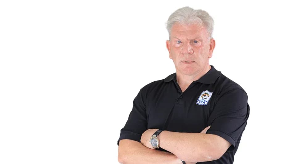 Man in black polo shirt with arms crossed Man in black polo shirt with arms crossed