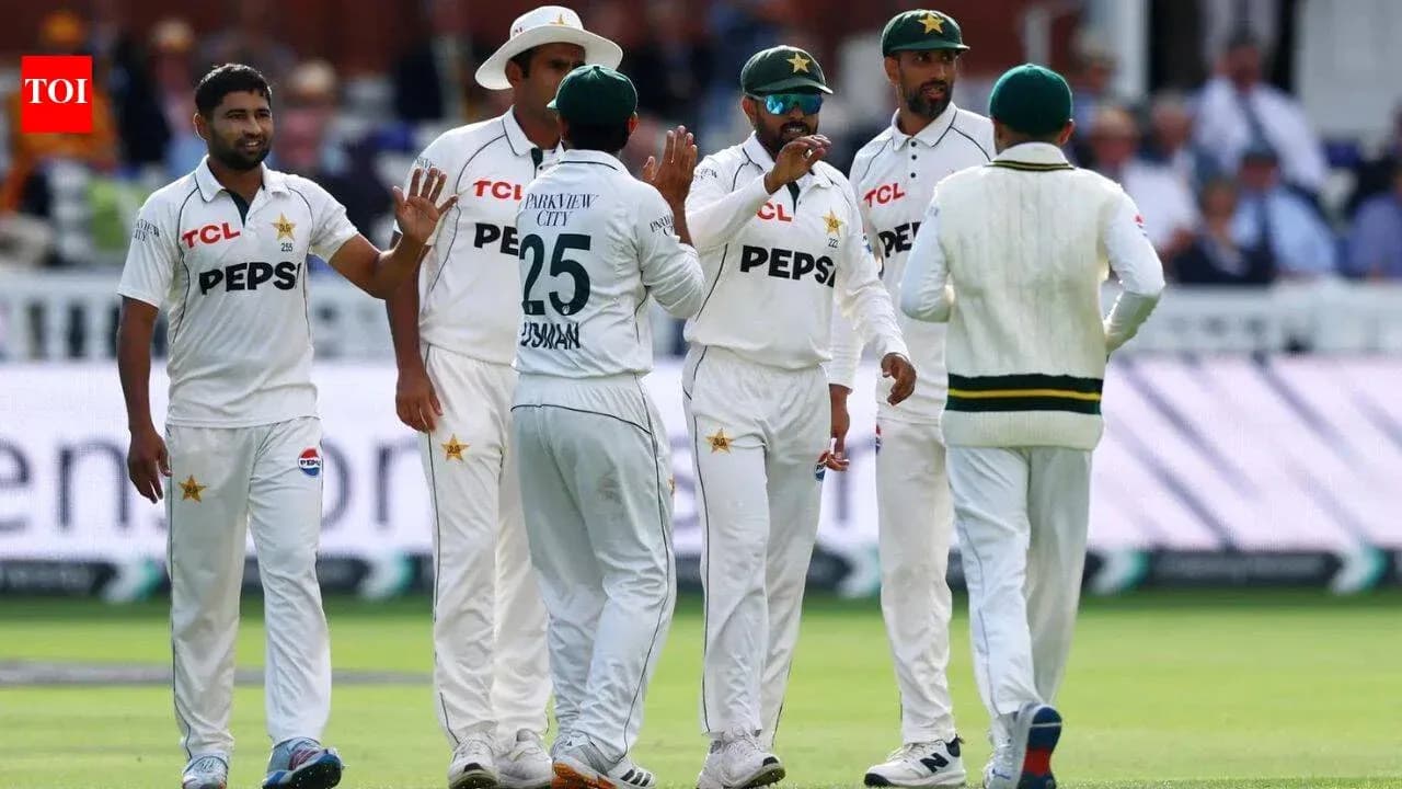 Pakistan cricket team celebrating a wicket on field Pakistan cricket team celebrating a wicket on field