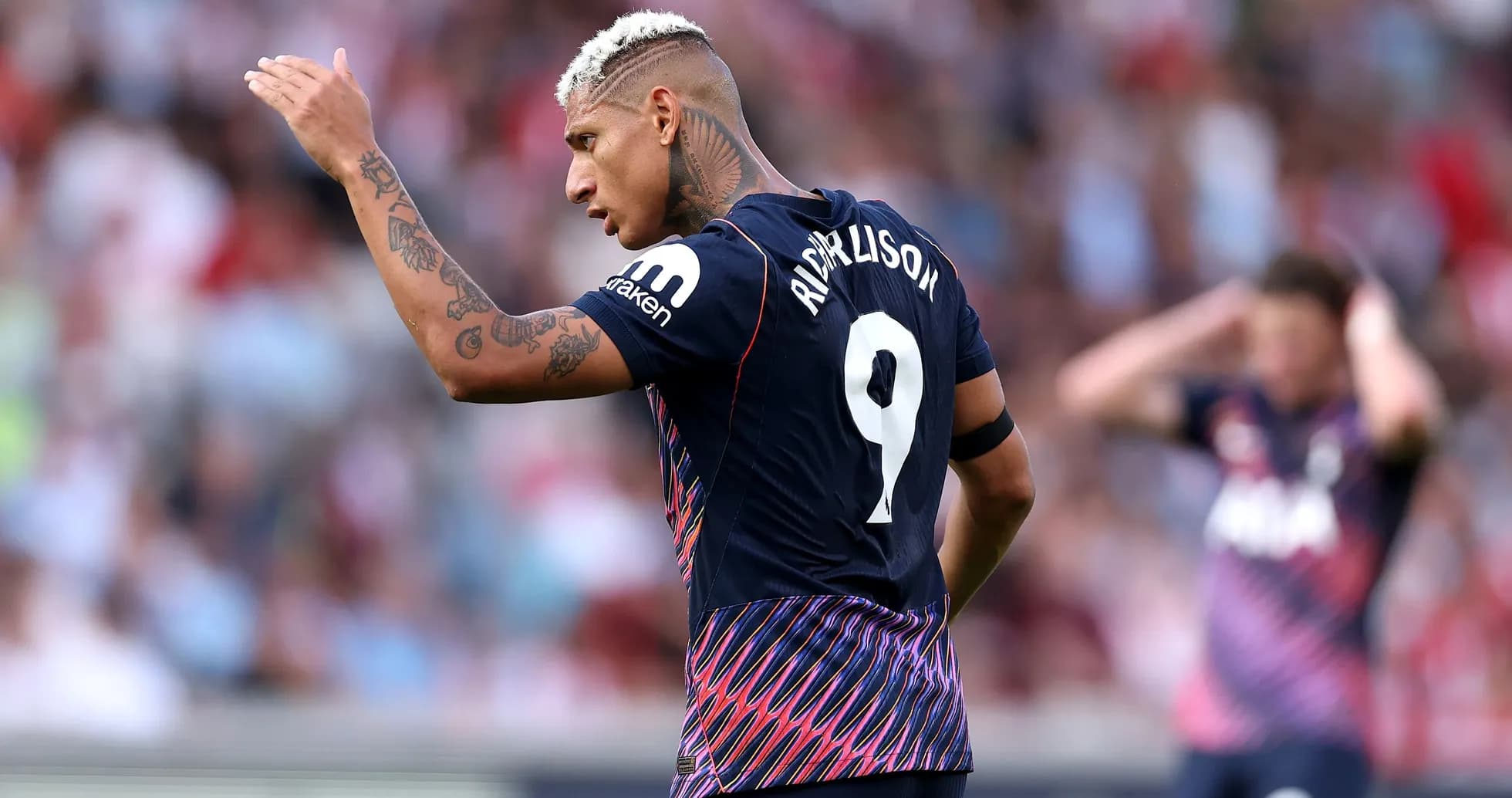Richarlison gesturing during a match on the field Richarlison gesturing during a match on the field