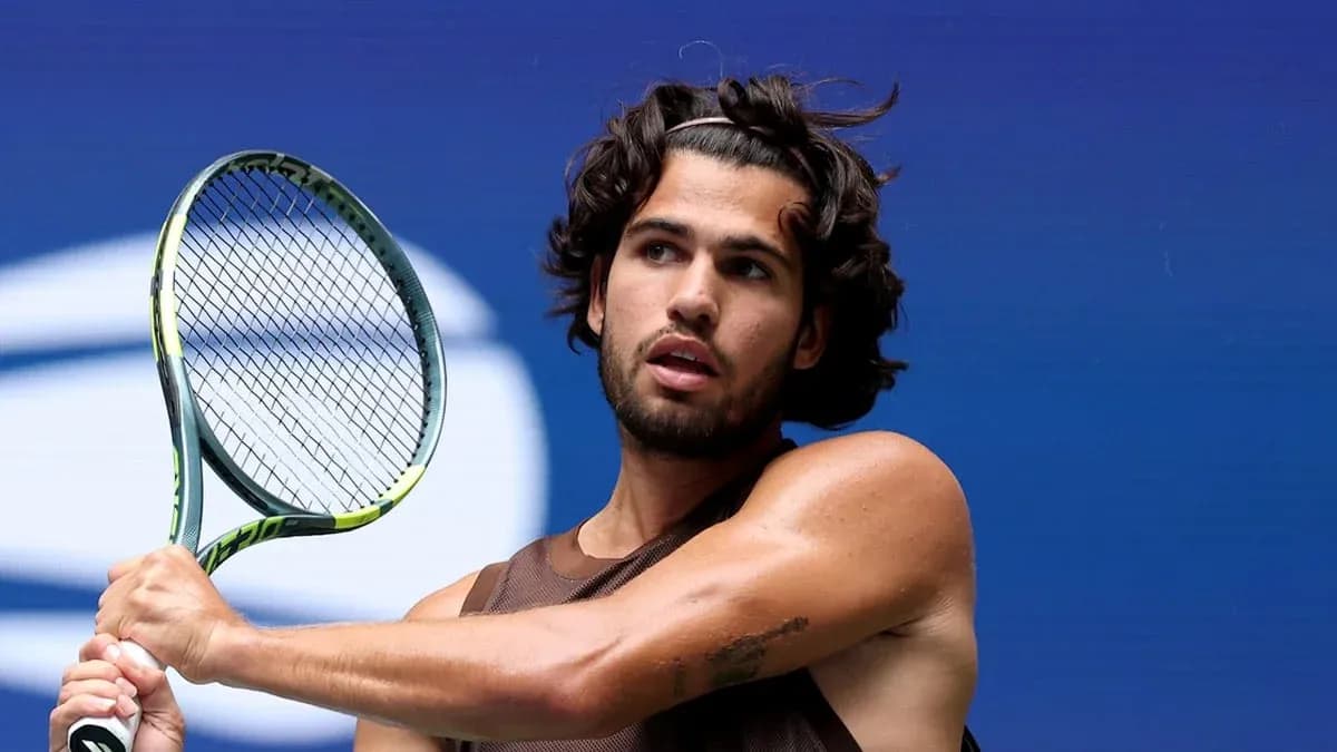Tennis player preparing to hit a backhand shot Tennis player preparing to hit a backhand shot