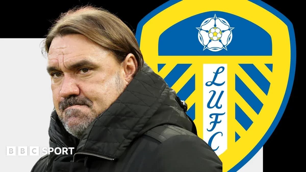 Coach in front of Leeds United club logo Coach in front of Leeds United club logo