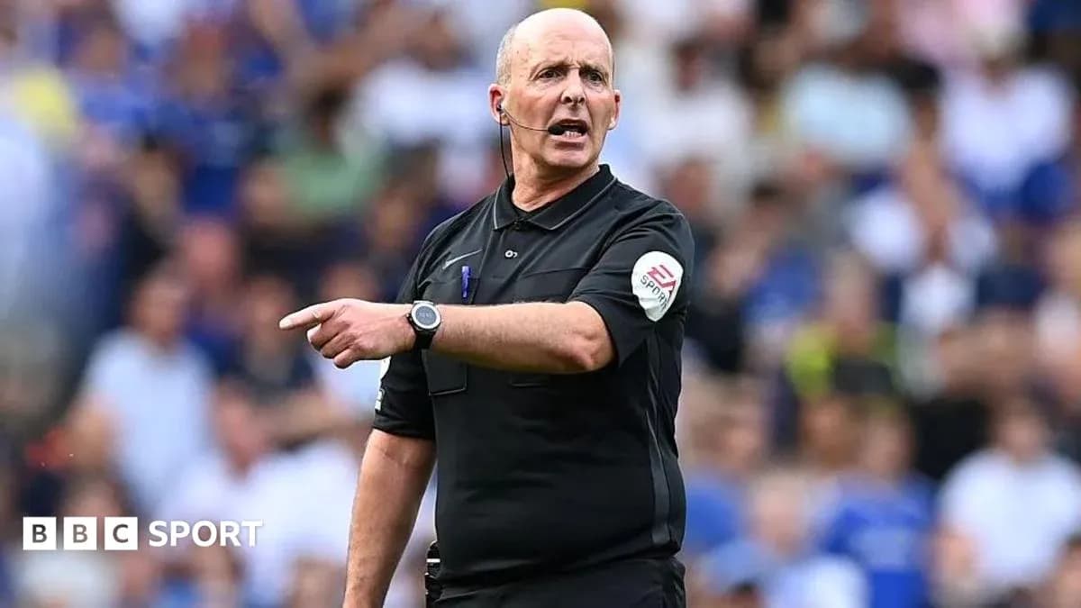 Referee gesturing during a football match Referee gesturing during a football match