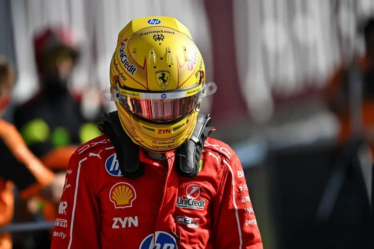 Racing driver in Ferrari suit and helmet Racing driver in Ferrari suit and helmet