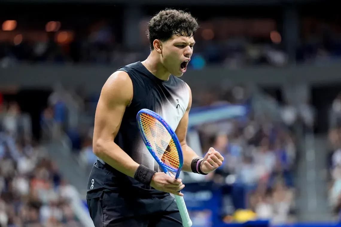 Tennis player celebrating during a match Tennis player celebrating during a match