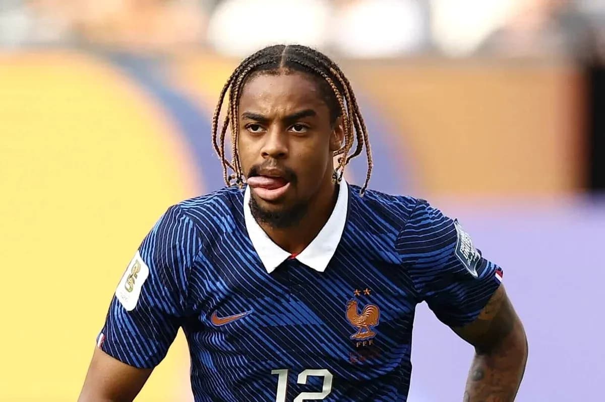 Player in France jersey during a match action Player in France jersey during a match action