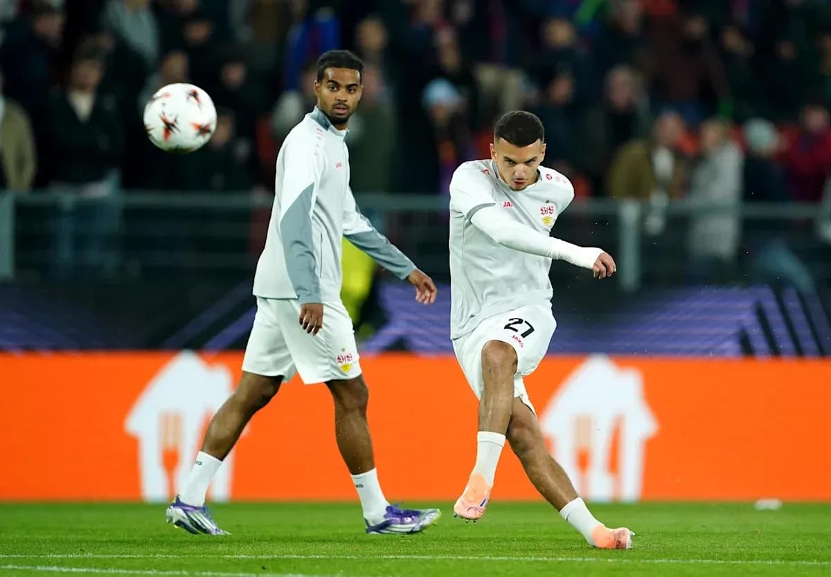 Player kicking ball during warm-up before match Player kicking ball during warm-up before match