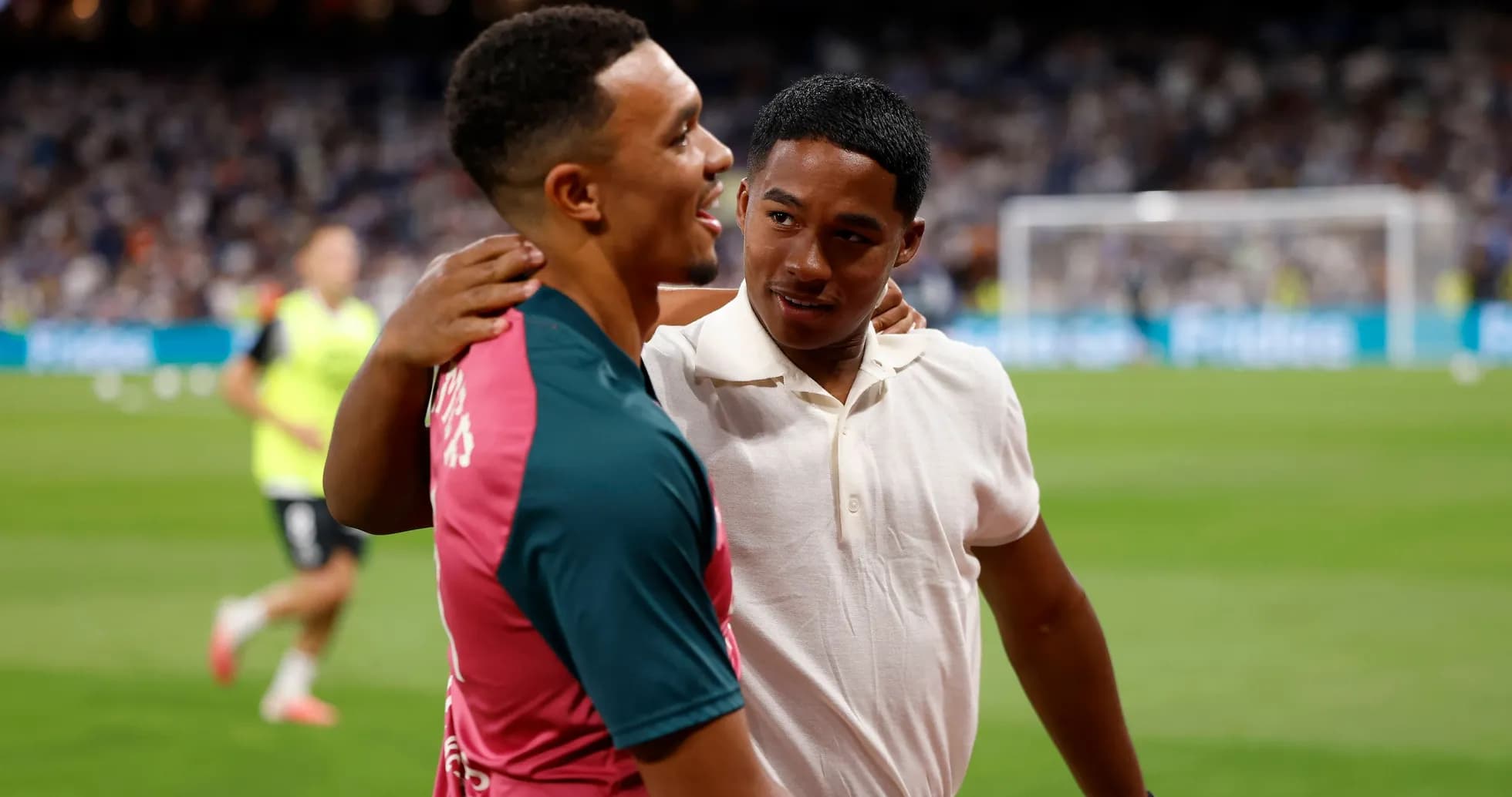 Two players embracing on the football field Two players embracing on the football field