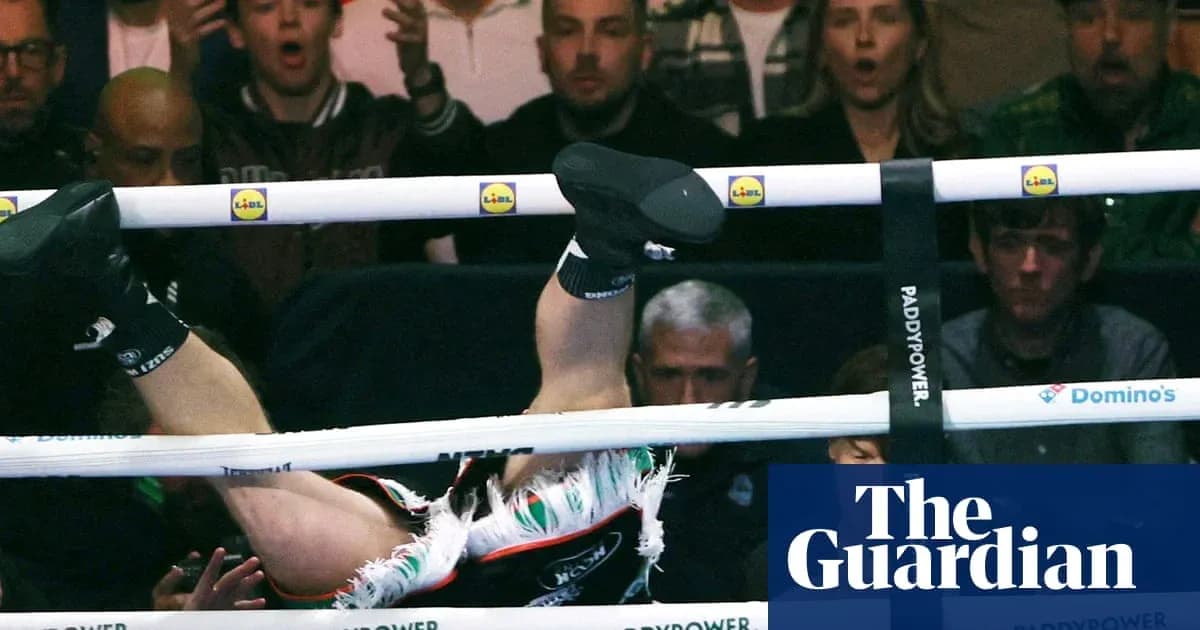 Boxer falling through ropes during a match Boxer falling through ropes during a match