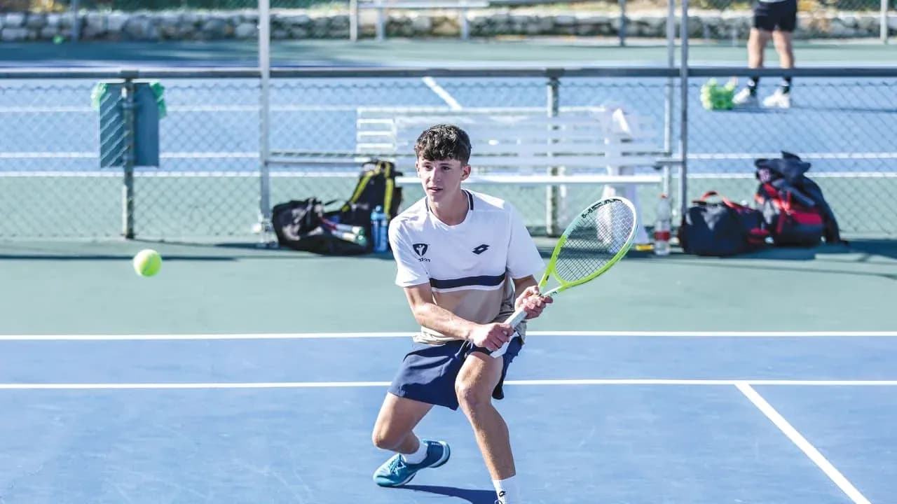 Player preparing to hit a tennis ball on court Player preparing to hit a tennis ball on court