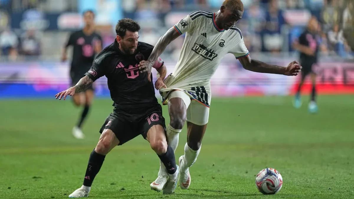 Lionel Messi challenges a Philadelphia Union player Lionel Messi challenges a Philadelphia Union player