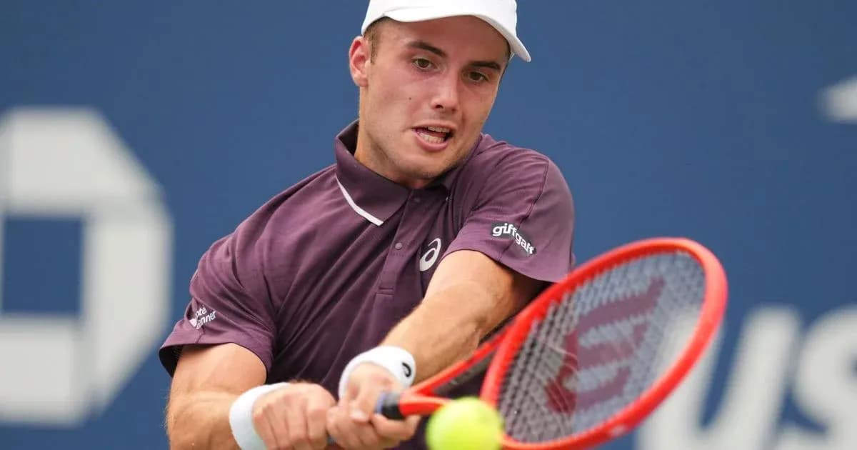 Tennis player hitting a forehand during match Tennis player hitting a forehand during match