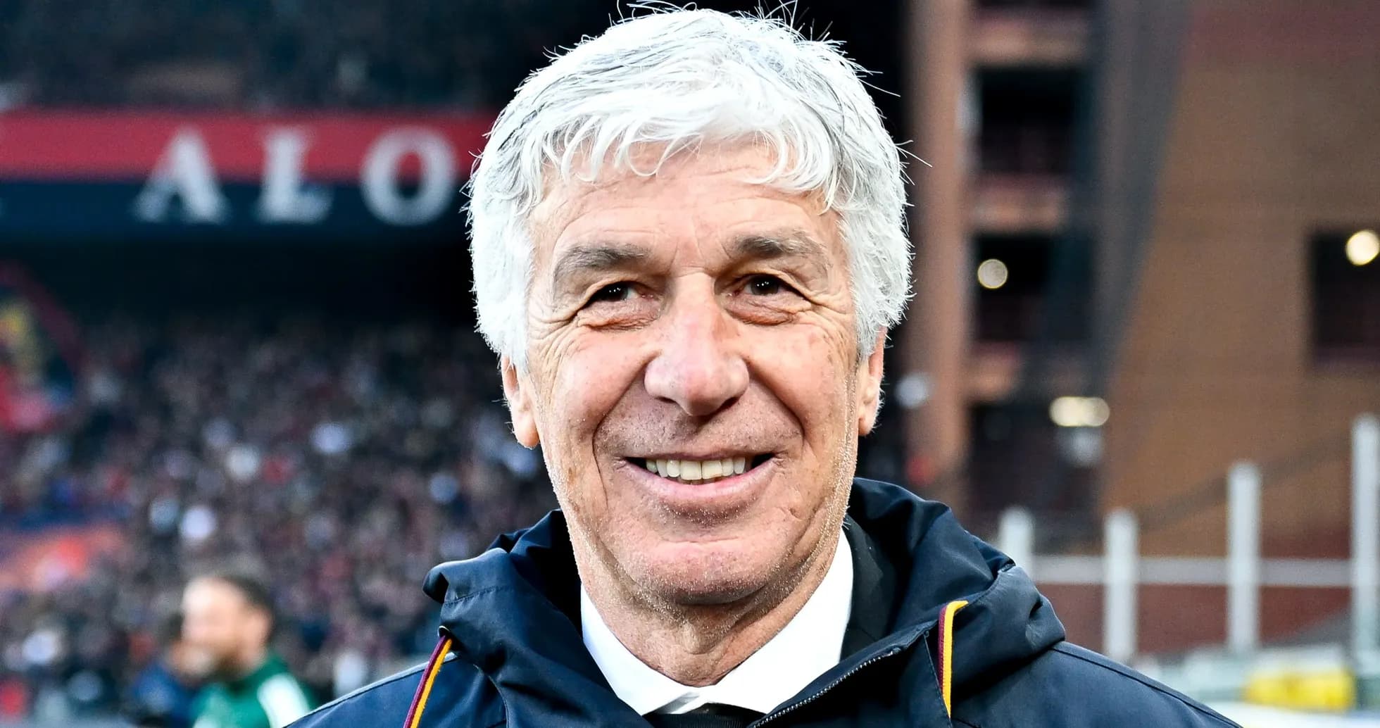 Coach smiling during a match at the stadium Coach smiling during a match at the stadium