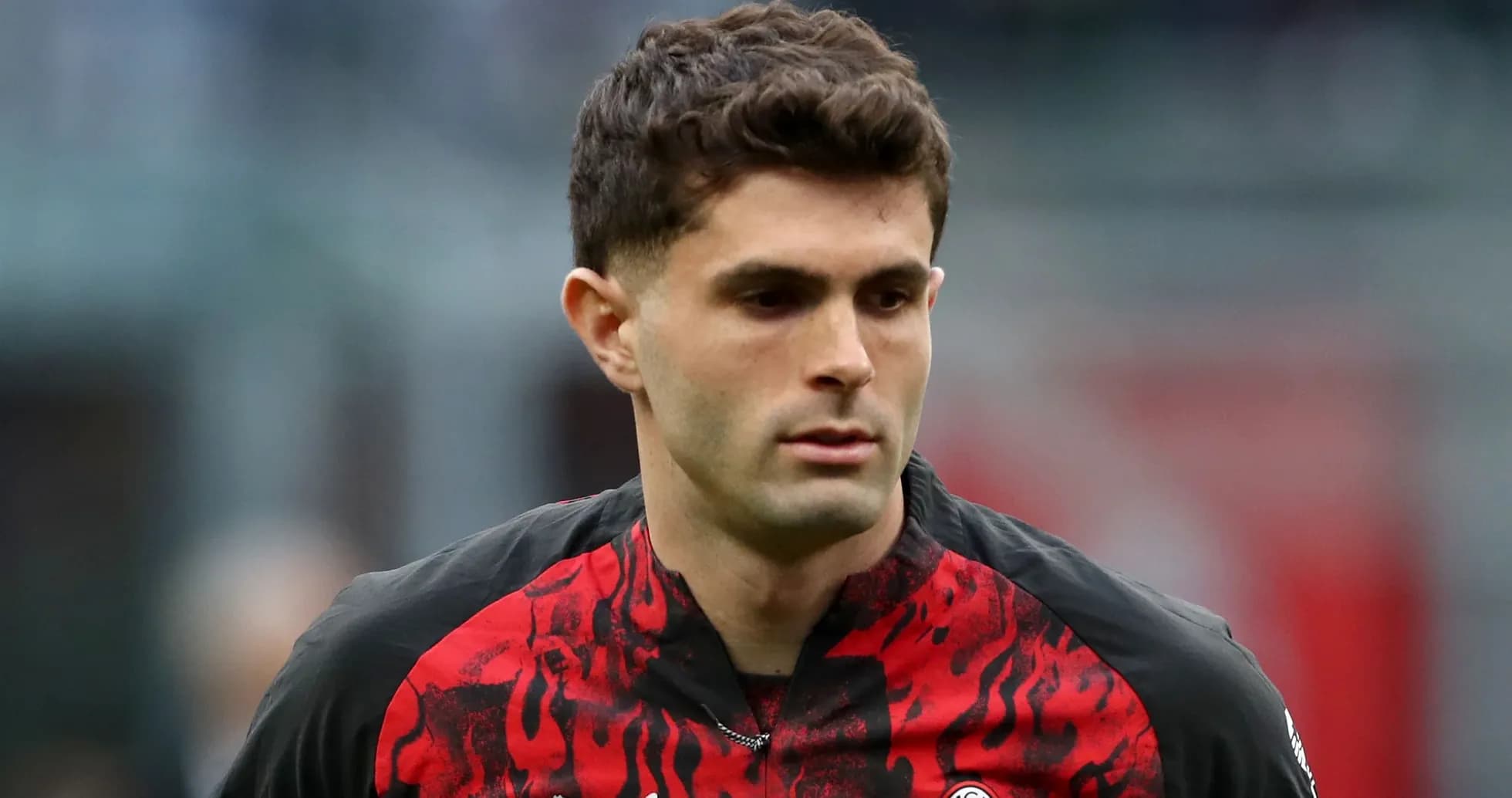 Player in red and black jersey during match Player in red and black jersey during match