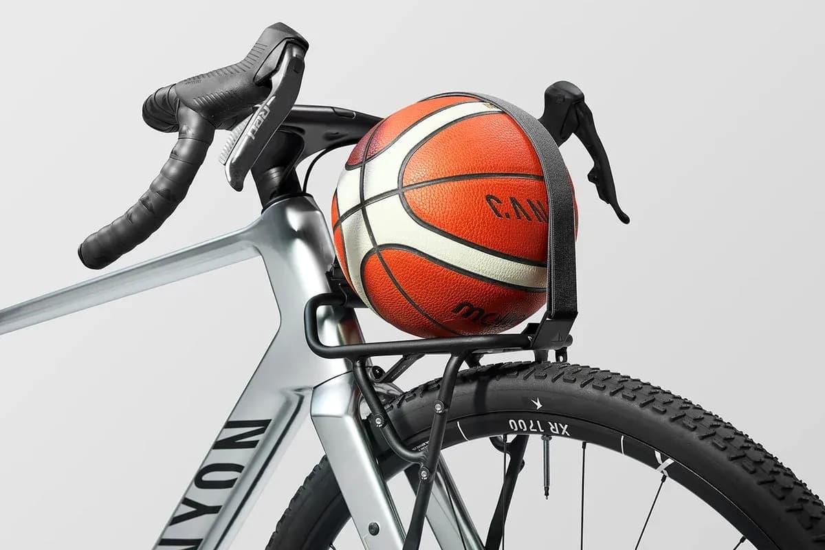Basketball secured on bicycle frame rack Basketball secured on bicycle frame rack