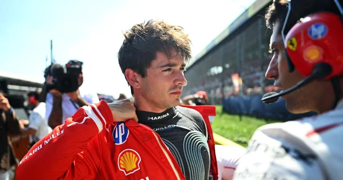 Driver adjusting his suit before the race Driver adjusting his suit before the race