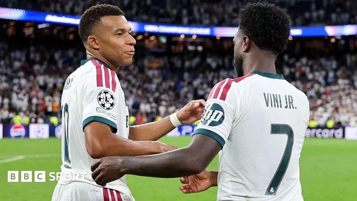 Mbappé and Vini Jr. celebrating on the field Mbappé and Vini Jr. celebrating on the field