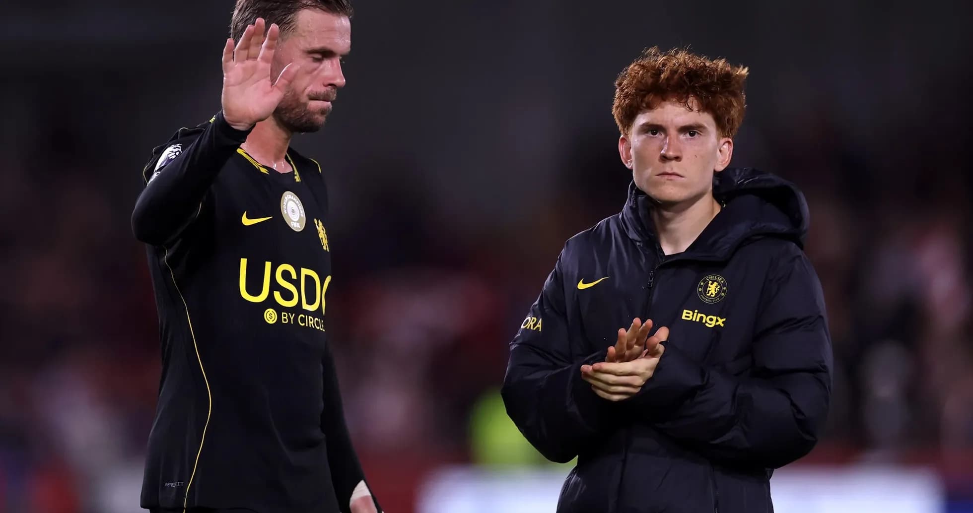 Two players acknowledging fans after match Two players acknowledging fans after match