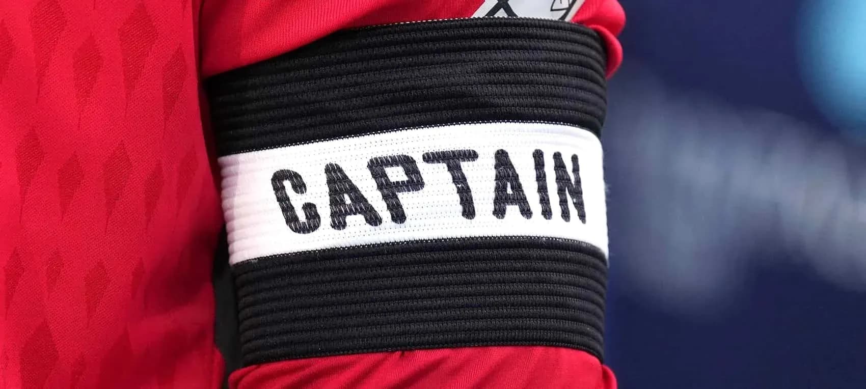 Close-up of a captain's armband with 'CAPTAIN' Close-up of a captain's armband with 'CAPTAIN'