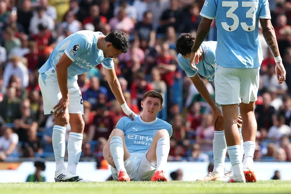Manchester City players assisting injured teammate on field Manchester City players assisting injured teammate on field