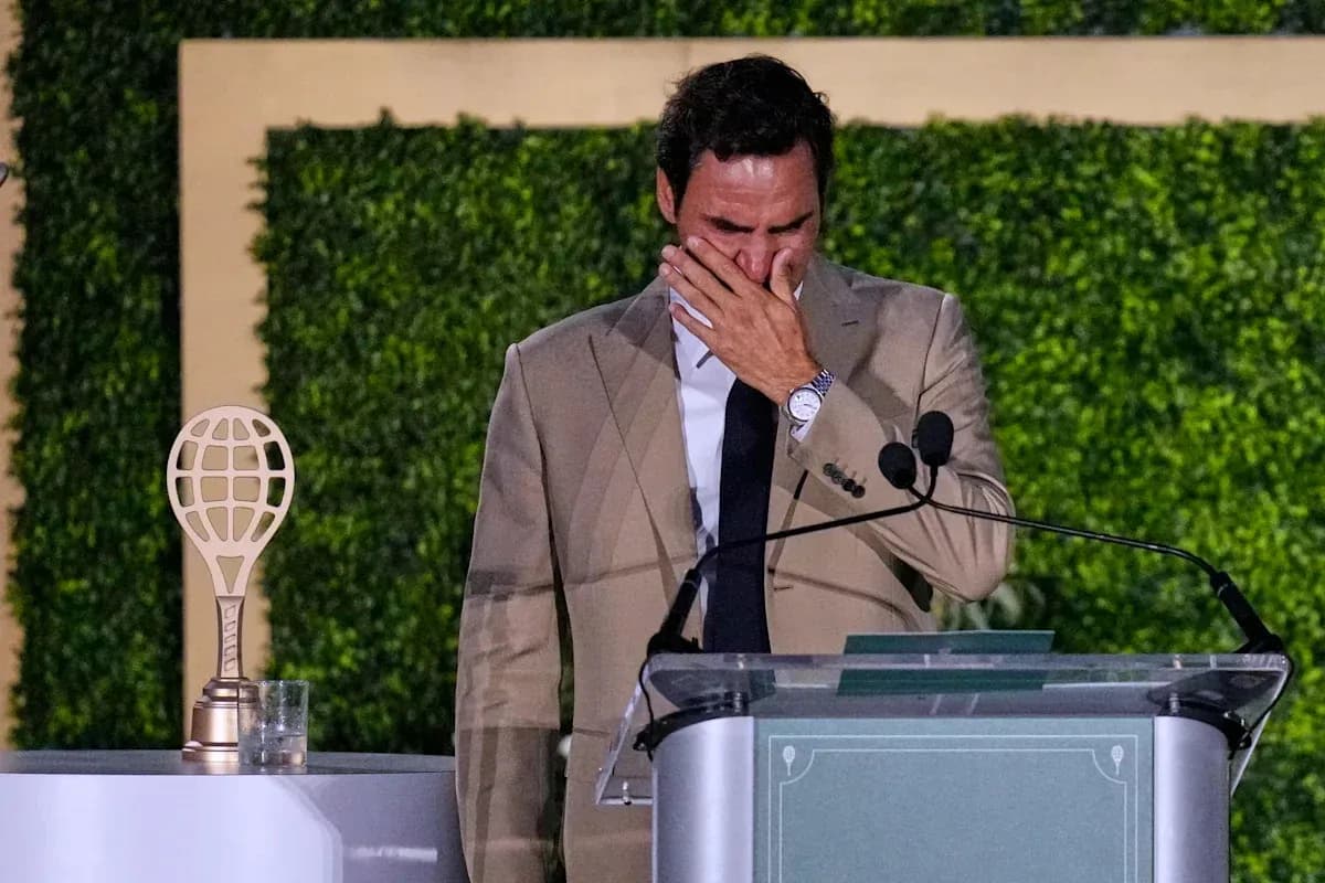 Roger Federer giving a speech at podium Roger Federer giving a speech at podium