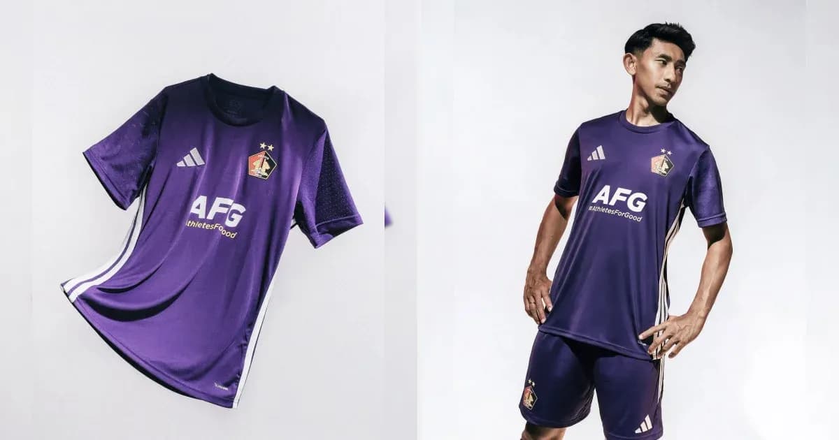Purple football kit displayed and worn by player Purple football kit displayed and worn by player