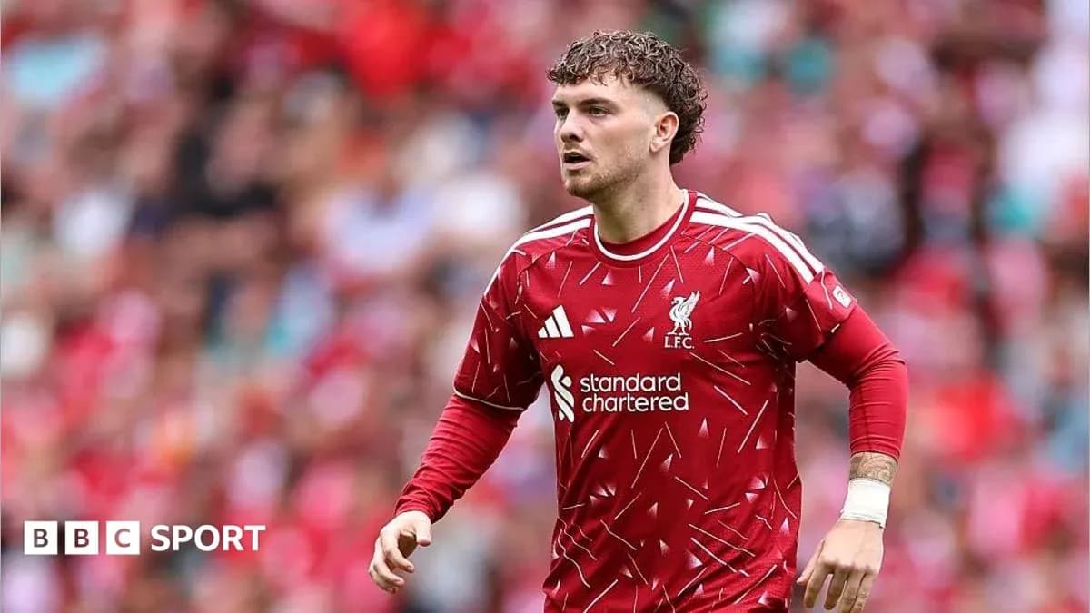 Liverpool player in red kit during match action Liverpool player in red kit during match action