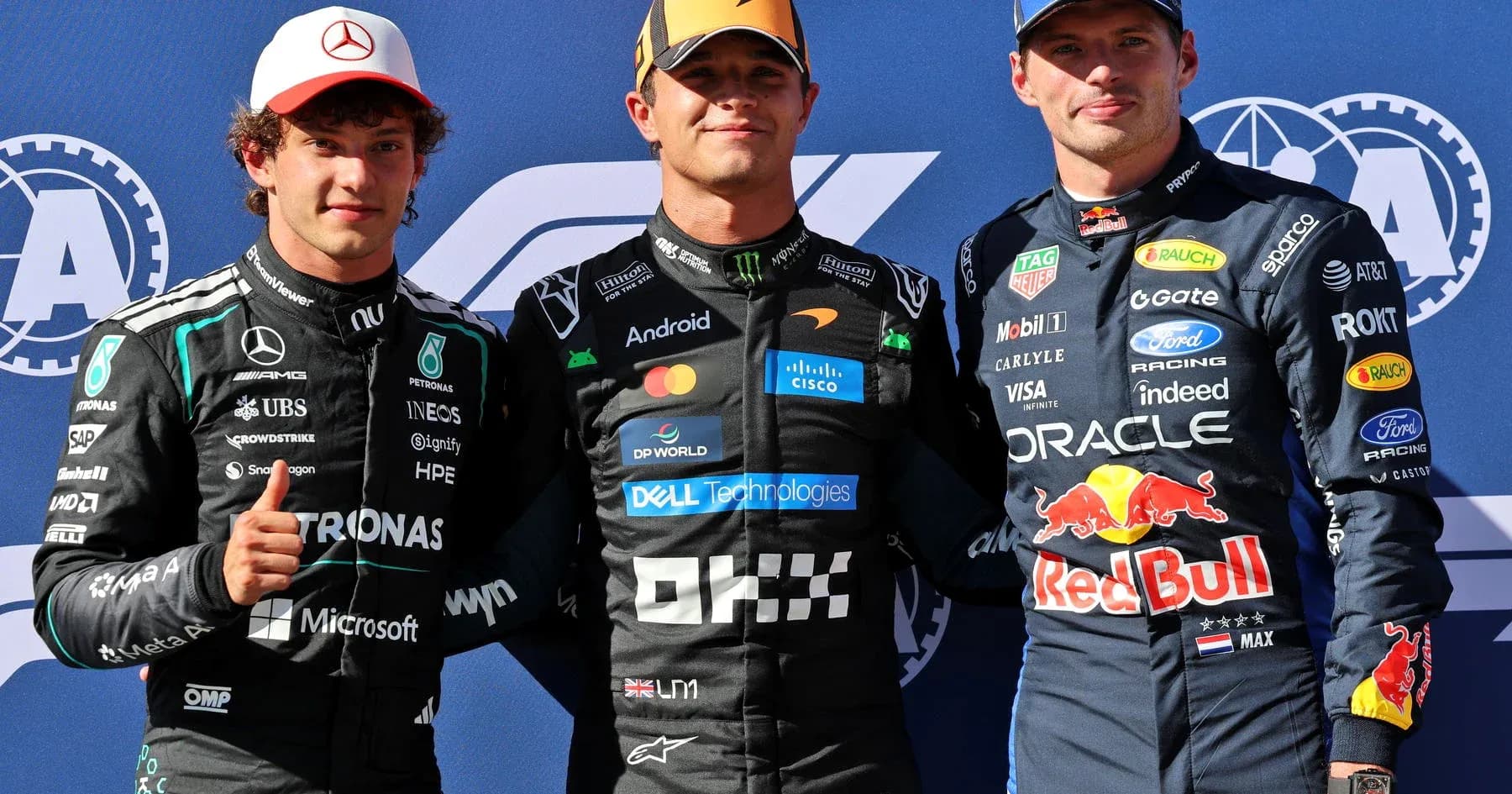 Three Formula 1 drivers posing for photo together Three Formula 1 drivers posing for photo together
