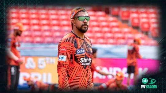 Player in orange jersey during warm-up session Player in orange jersey during warm-up session