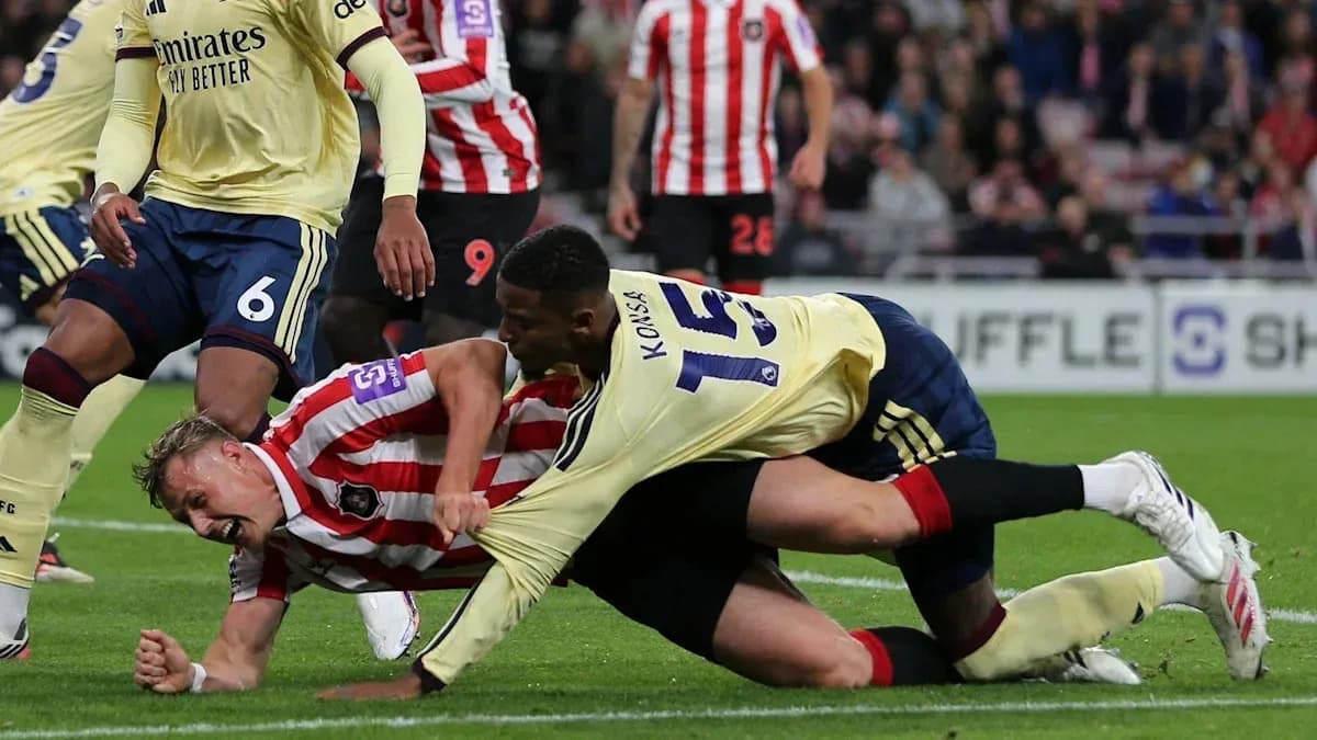 Player tackling opponent during football match Player tackling opponent during football match
