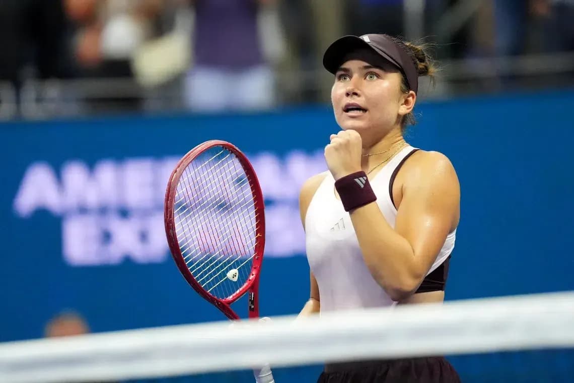Tennis player celebrating during a match Tennis player celebrating during a match