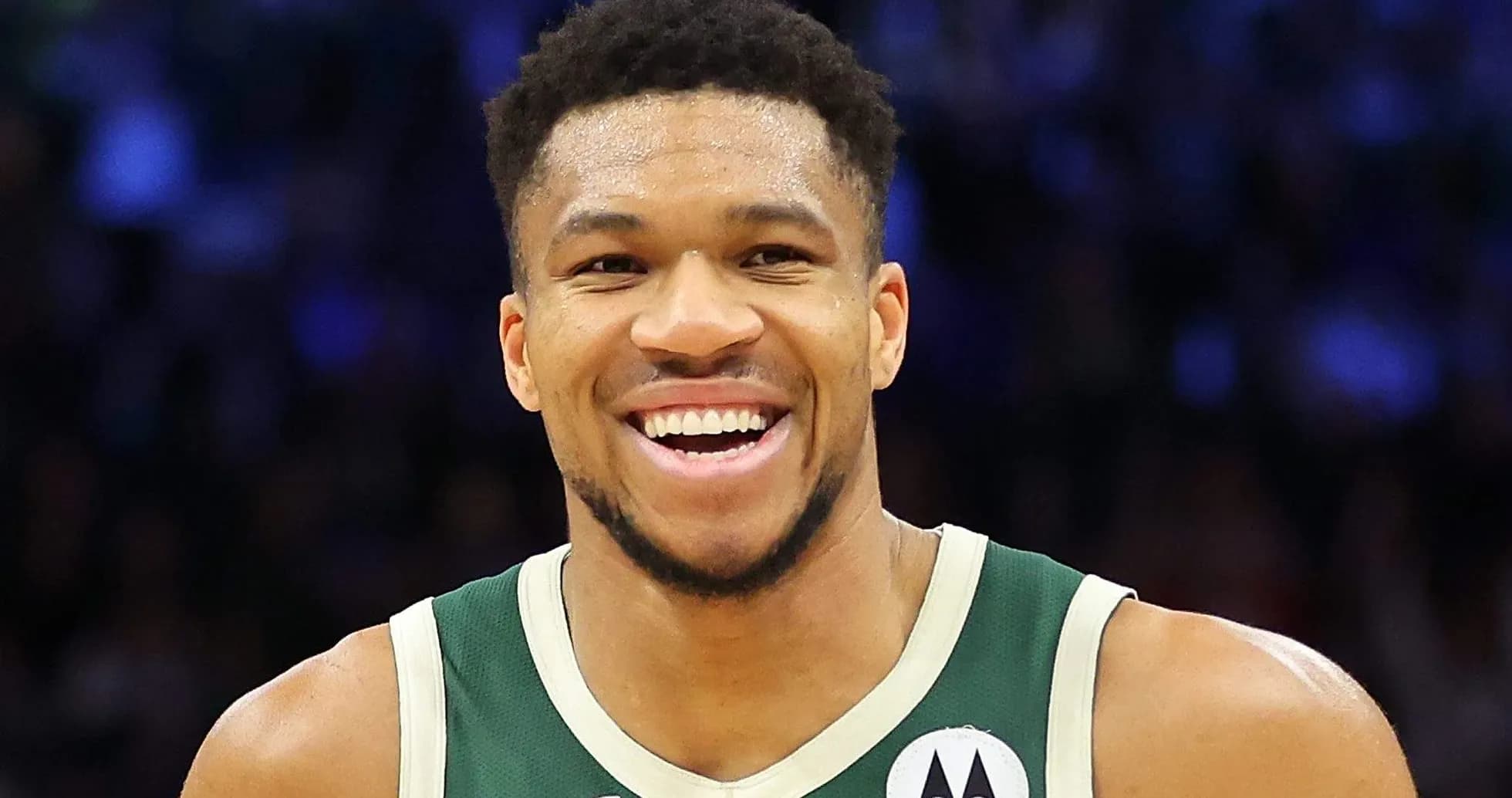 Player smiling in Milwaukee Bucks uniform Player smiling in Milwaukee Bucks uniform