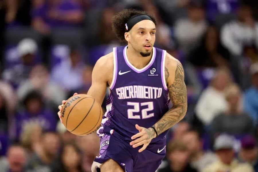 Player dribbling the ball during a basketball game Player dribbling the ball during a basketball game