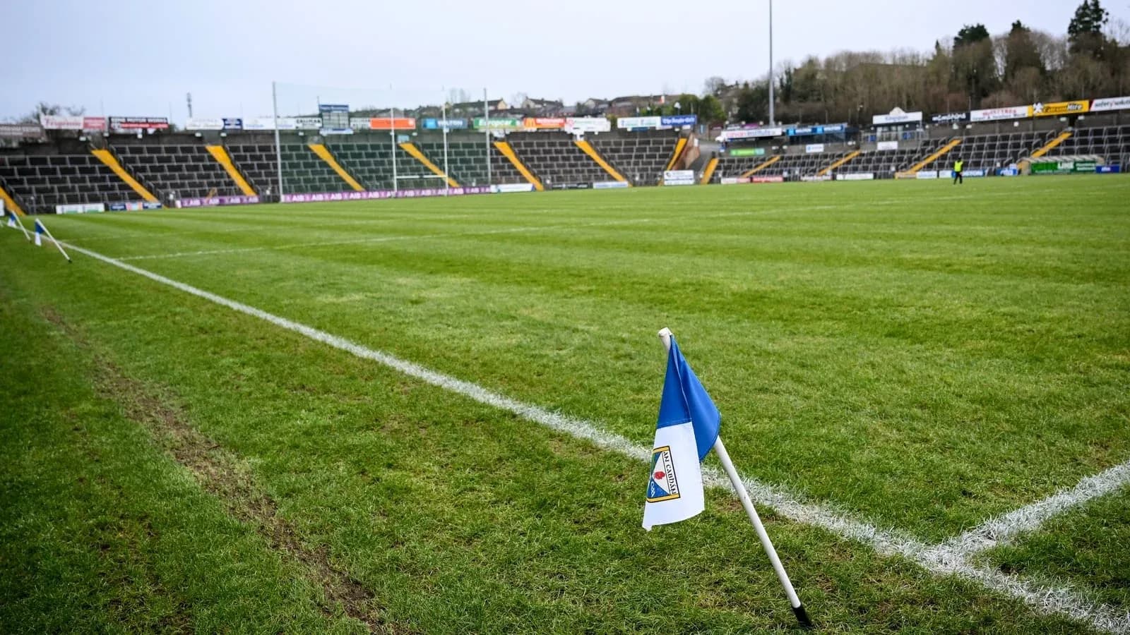 Corner flag on a rugby pitch with empty stands Corner flag on a rugby pitch with empty stands