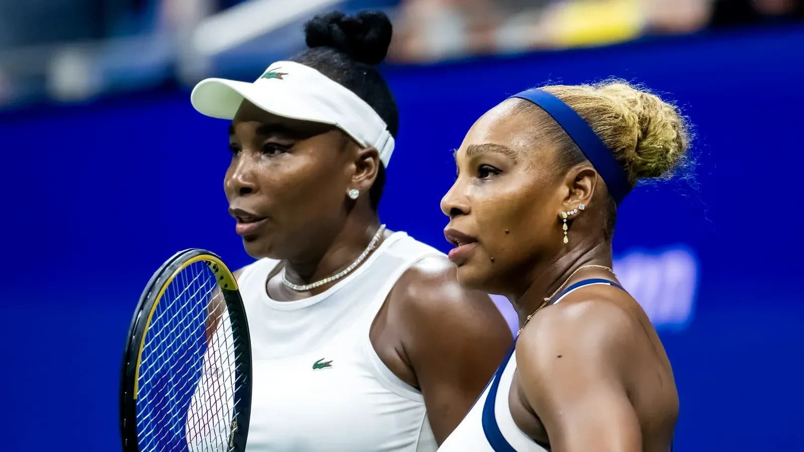 Venus and Serena Williams during a tennis match Venus and Serena Williams during a tennis match