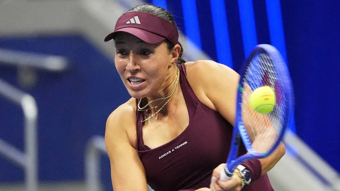 Female tennis player hitting a forehand shot Female tennis player hitting a forehand shot
