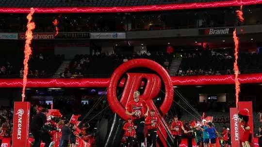 Players entering arena through inflatable tunnel with flames Players entering arena through inflatable tunnel with flames
