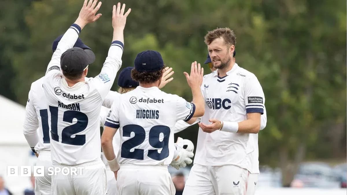 Middlesex players celebrating a wicket on field Middlesex players celebrating a wicket on field