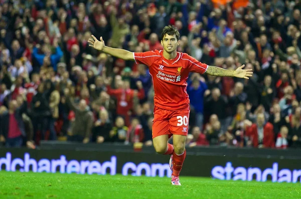 Player celebrating a goal at Anfield stadium Player celebrating a goal at Anfield stadium