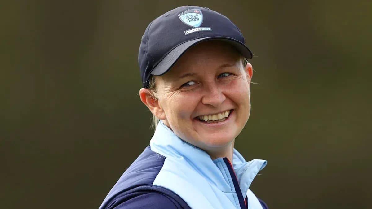 Cricketer smiling during a practice session Cricketer smiling during a practice session
