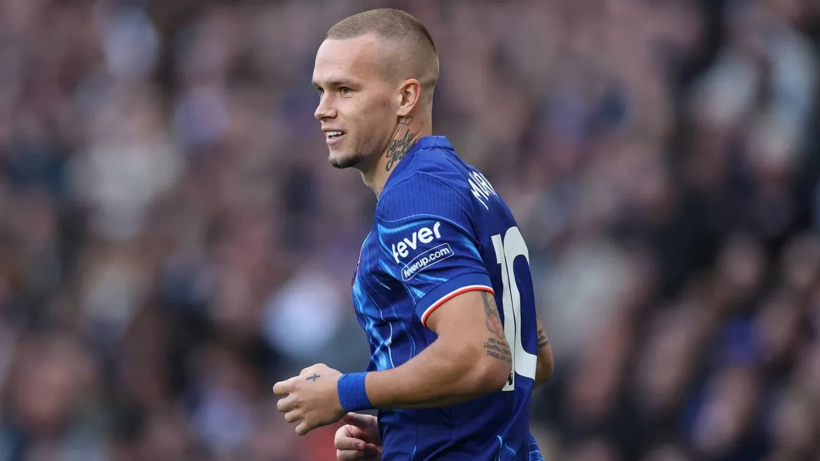 Player in blue jersey during football match Player in blue jersey during football match