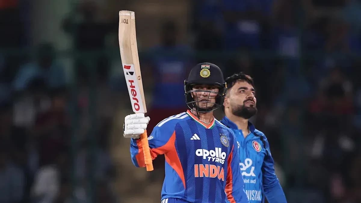 Batsman celebrating with raised bat during match Batsman celebrating with raised bat during match