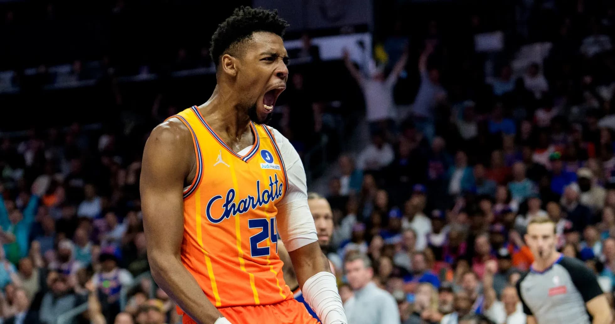 Player celebrating after scoring during basketball game Player celebrating after scoring during basketball game