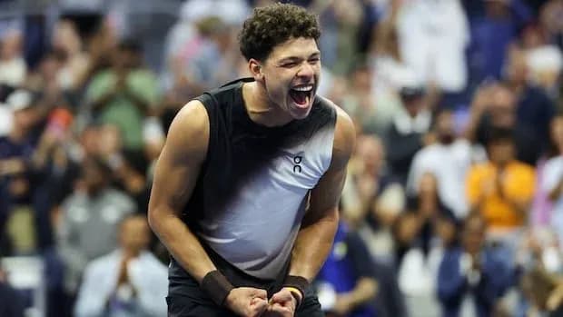 Player celebrating victory at a tennis match Player celebrating victory at a tennis match