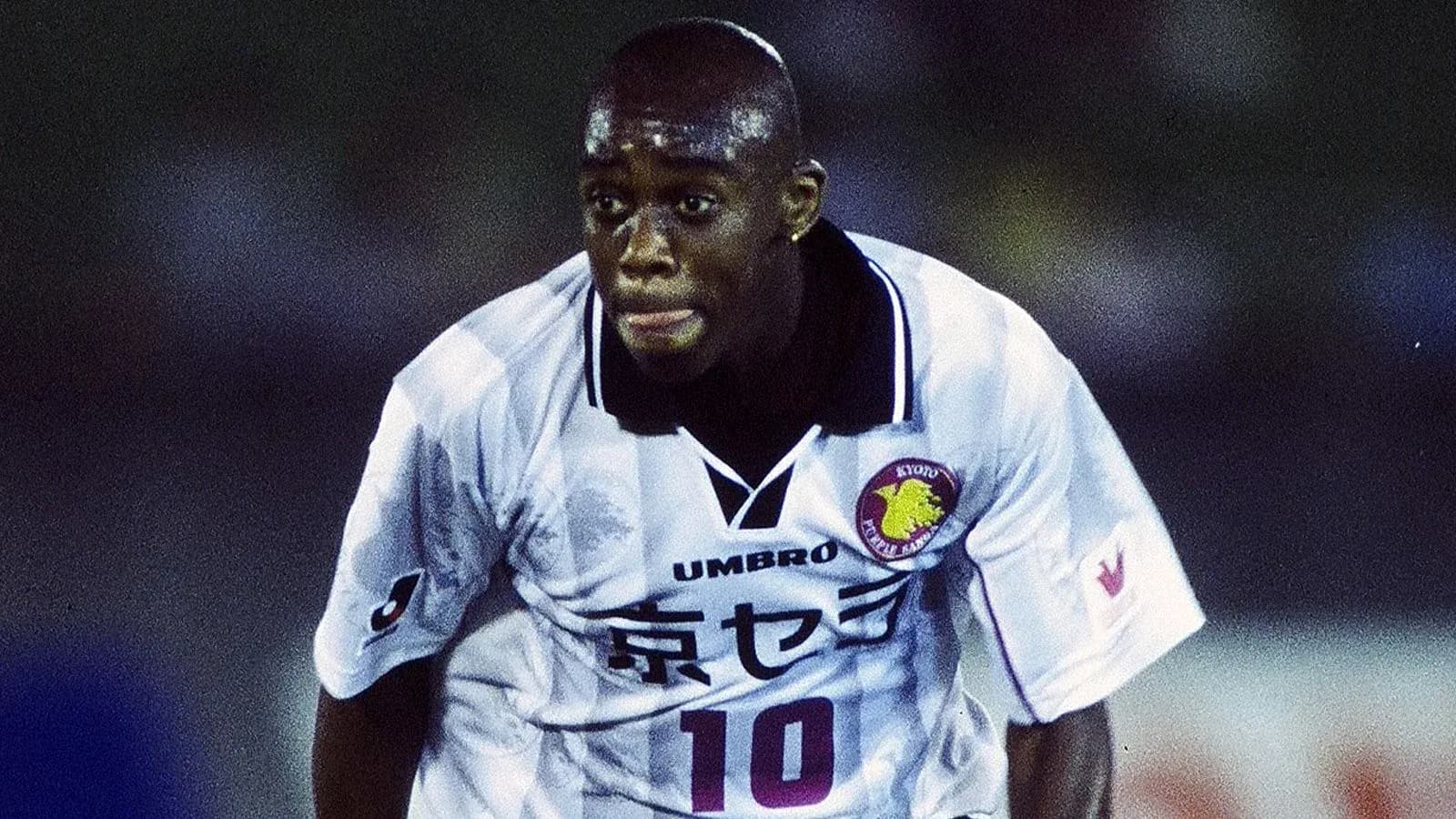 Player in action wearing Kyoto Purple Sanga jersey Player in action wearing Kyoto Purple Sanga jersey