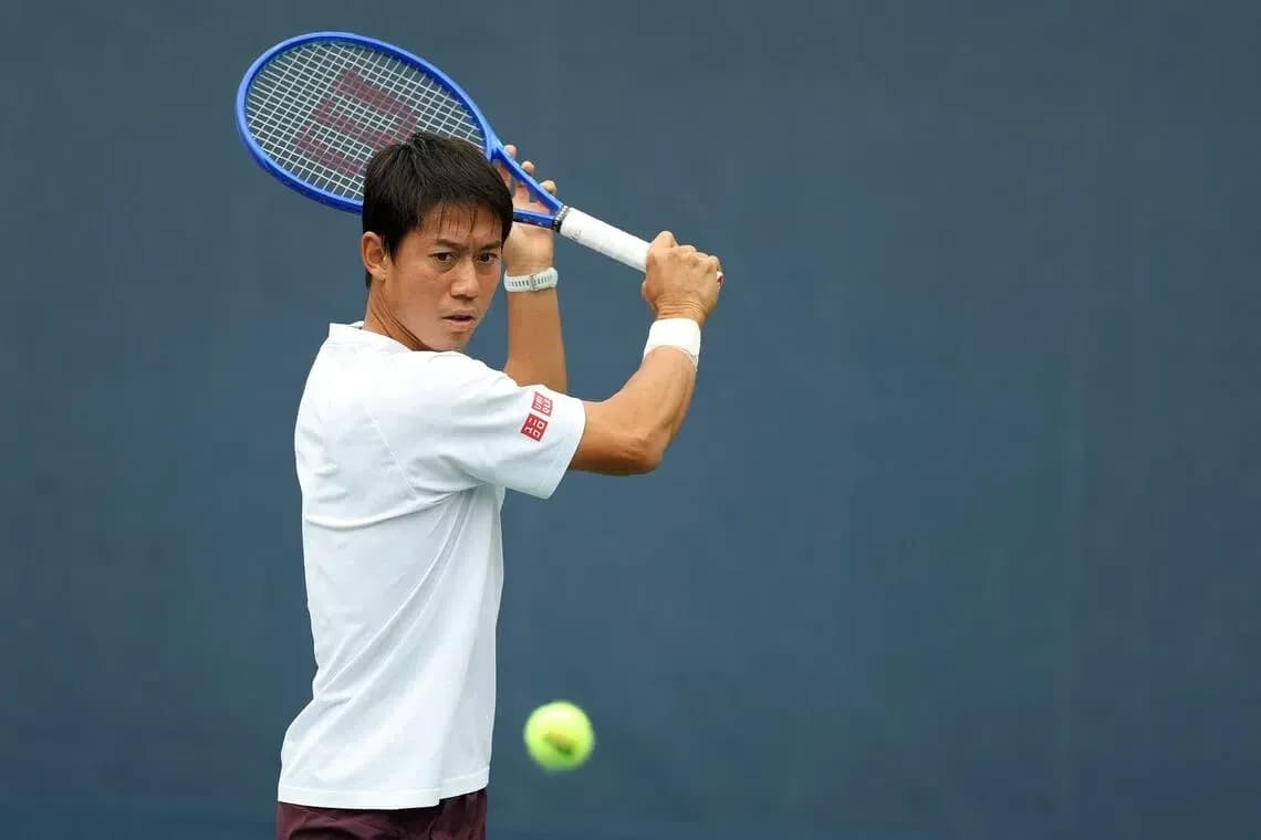 Tennis player preparing to hit a backhand shot Tennis player preparing to hit a backhand shot