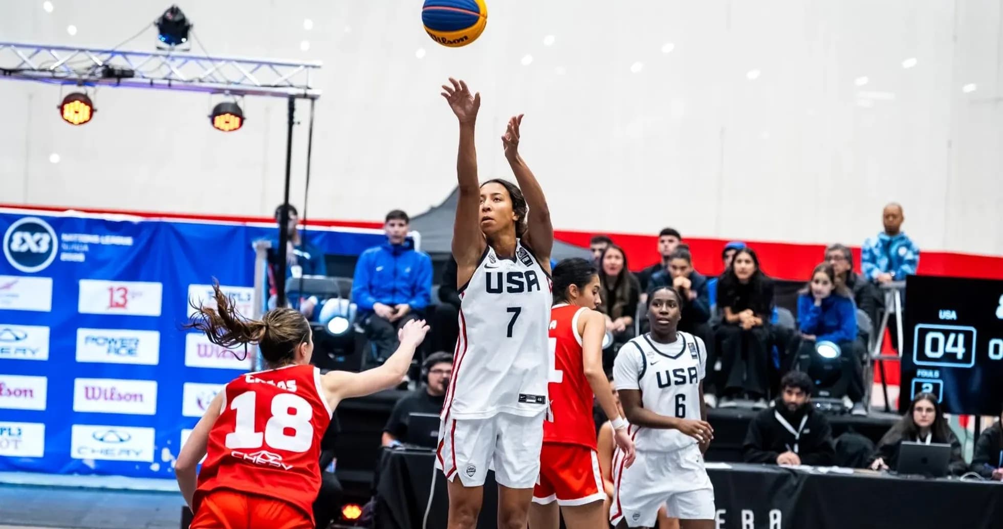 USA player shooting the ball during basketball game USA player shooting the ball during basketball game