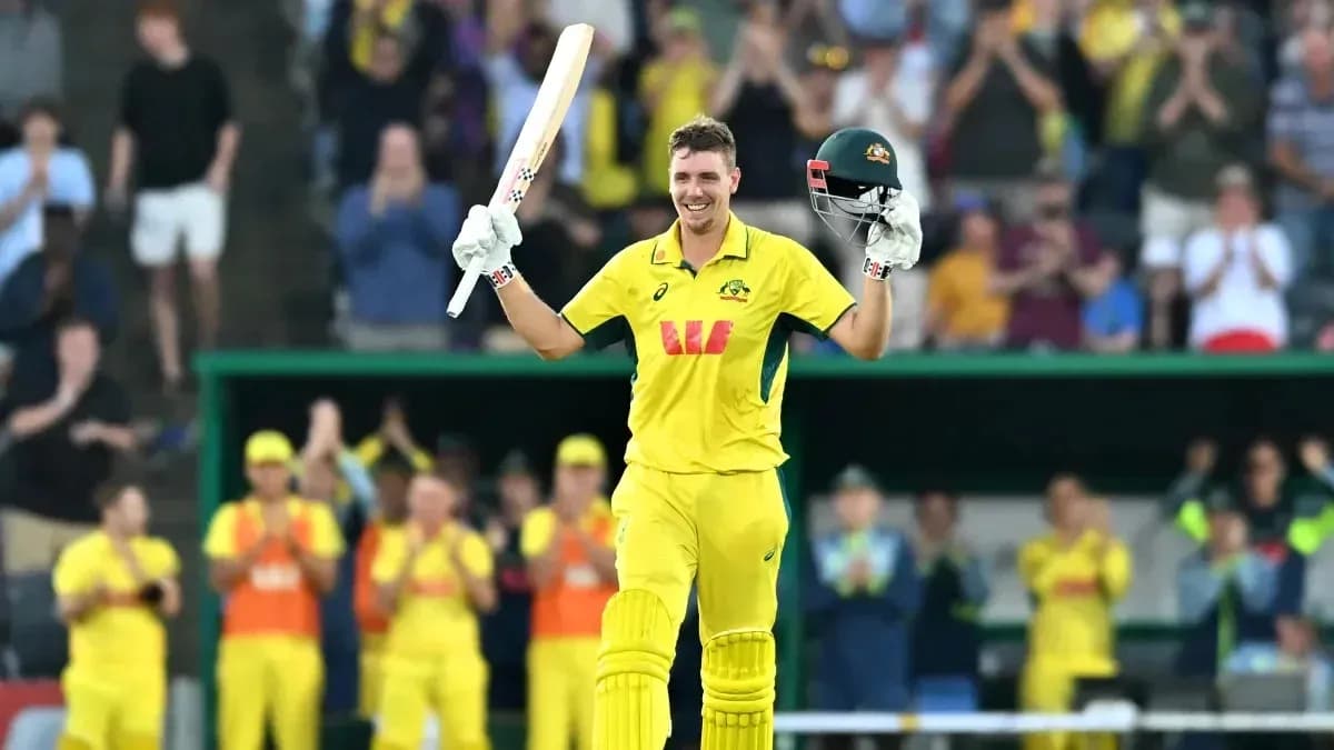 Cricketer celebrating century with raised bat and helmet Cricketer celebrating century with raised bat and helmet